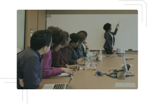 Women giving a talk in a conference room